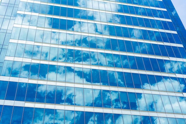 Underside panoramic and perspective view to steel blue glass high rise building skyscrapers