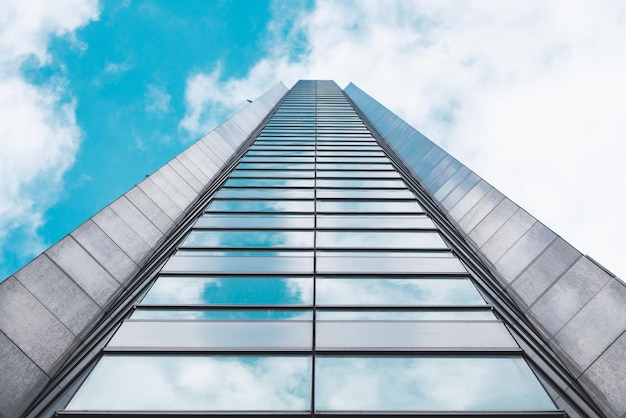 Underside panoramic and perspective view to steel blue glass high rise building skyscrapers