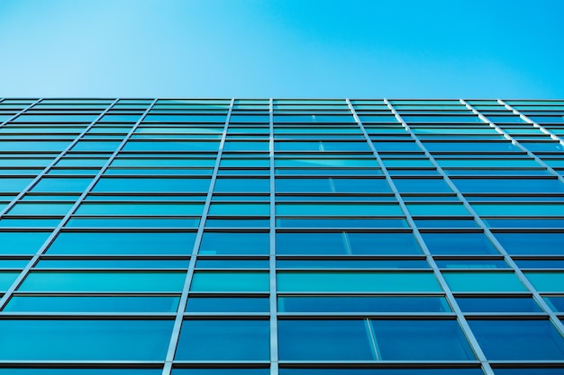 Underside panoramic and perspective view to steel blue glass high rise building skyscrapers