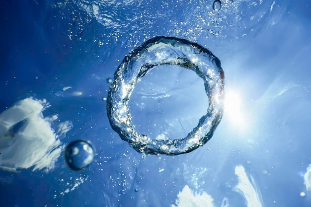 Underwater Bubble Ring Ascends towards the Sun