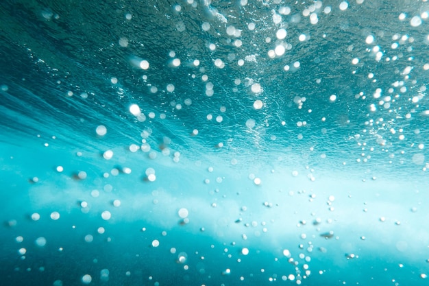 Underwater View of Bubbles In Deep Blue Sea Close Up Water Background