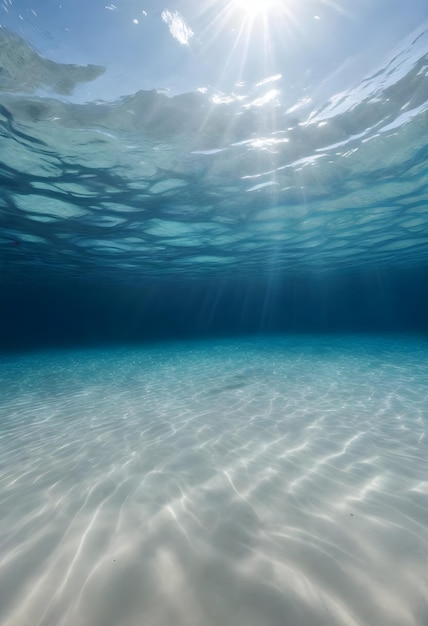 Underwater view with sun rays penetrating the clear blue water and casting patterns