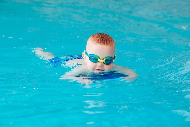 Underwater young friends in swimming pool