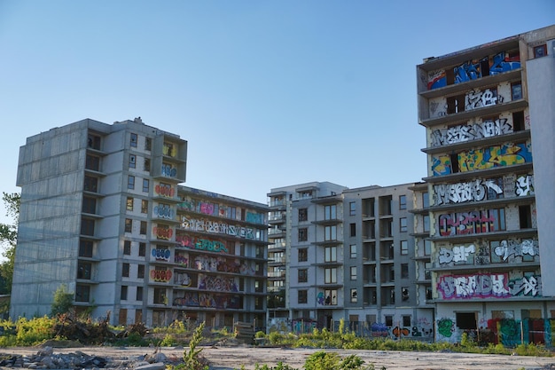 Unfinished abandoned residential building covered with graffiti