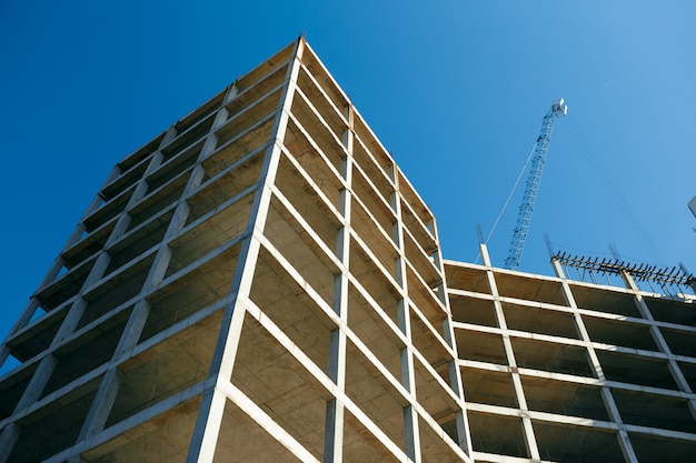 Unfinished cement building at a construction site in the summer