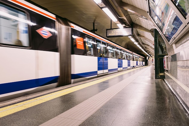 Unfocused train entering or leaving the 'Banco de EspaÃÂÃÂ±a' station of the Madrid Metro in Spain