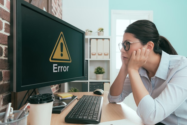 Photo unhappy business lady looking at computer error information feeling frustrated.