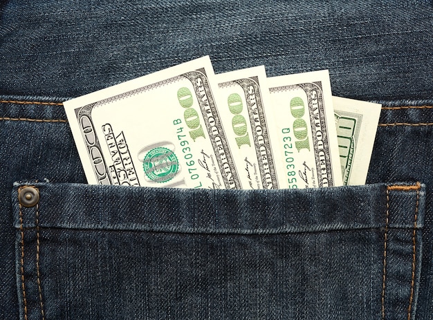 United States dollar bills in the back pocket of jeans