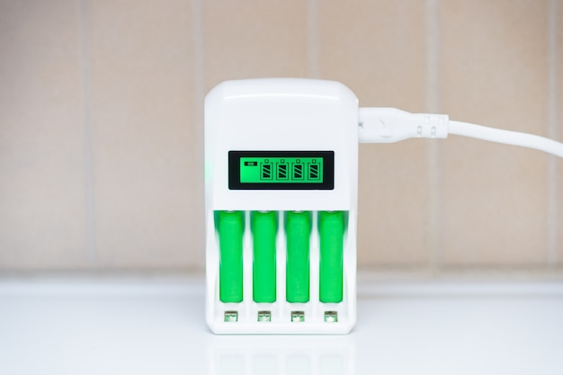 Universal charger for finger batteries. smart charger with charge indicator