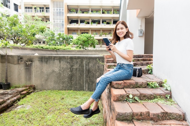 University student is holding tablet 