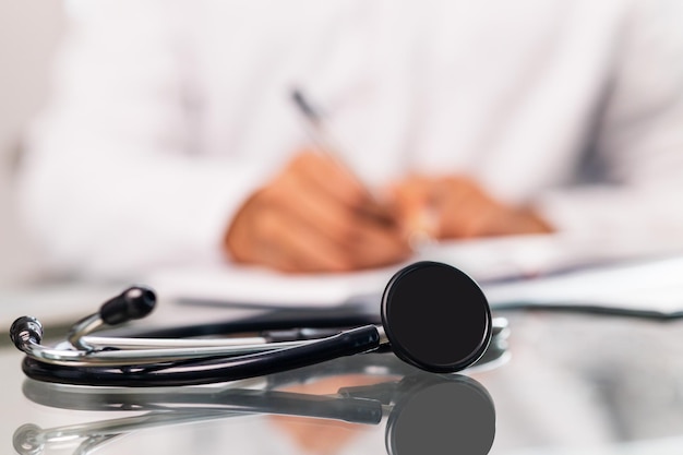 Unrecognizable male doctor In uniform and stethoscope close up