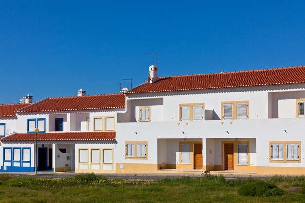 Unrecognizable Part of Residential House at Algarve, Portugal. Bright Blue Sky as a Background