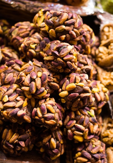 Unshelled Pistachio nut in view as food background