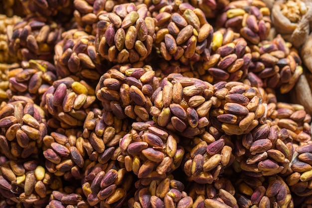 Unshelled Pistachio nut in view as food background