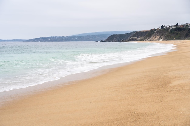 Untouched sand by the sea at empty beach on cloudy morning in Algarrobo Chile Natural landscape