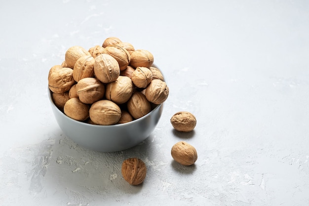 Untreated walnut in a bowl