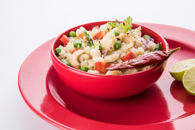 Upma or Uppittu is a popular breakfast dish in South India and Maharashtra. Semolina or Rava or coarse rice flour is main ingredients. Served in a bowl over colourful or wooden background