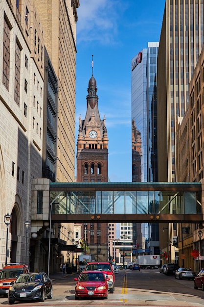 Urban Bustle with Historic Clock Tower and Modern Skywalk Milwaukee