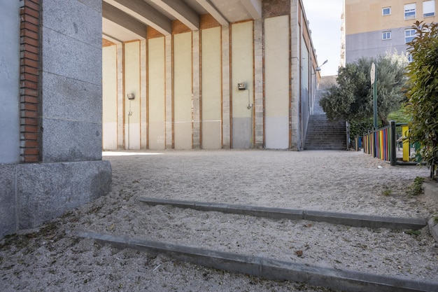 An urban corner with sand on the floor