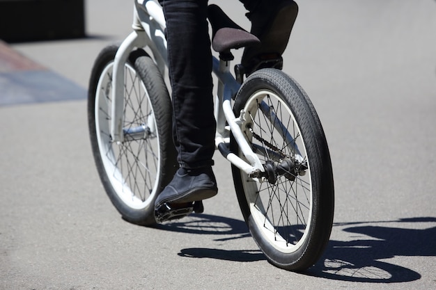 The urban cyclist in motion on the sidewalk