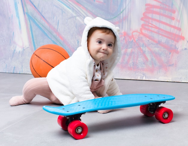 Urban look baby with skateboard