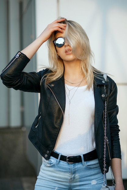 Urban shoot of young sexy woman wearing glasses and casual apparel