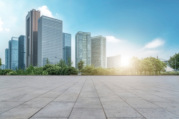 Urban skyscrapers with empty square floor tiles