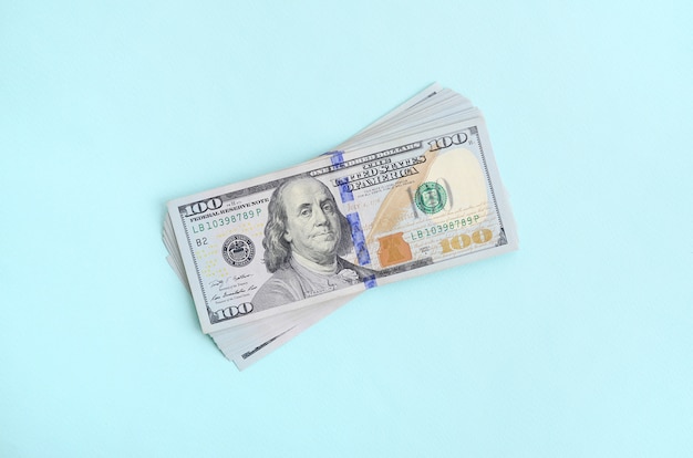 US dollar bills of a new design with a blue stripe in the middle 