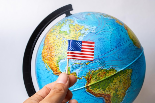 USA flag on background of globe with map