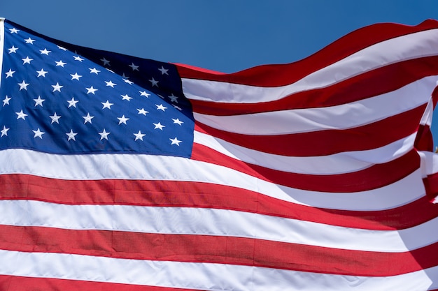 USA flag on a blue sky background