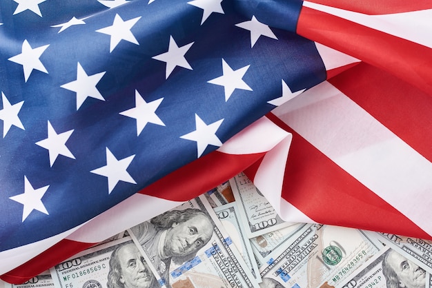 USA national flag and currency usd money banknotes. Business and finance concept