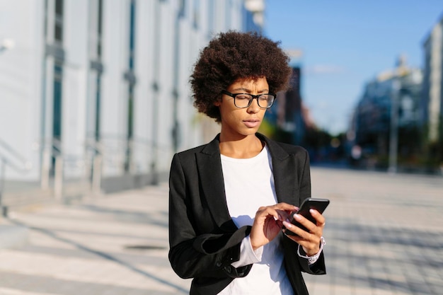 USA New York City businesswoman using smartphone