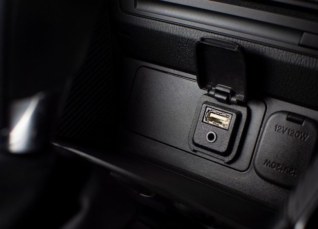 USB and aux ports for connecting multimedia players in luxury car.