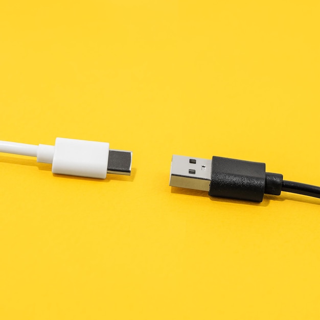 USB cable type C cable over yellow background