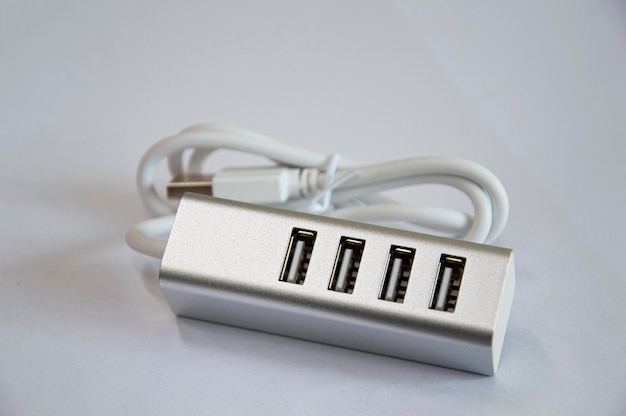 USB hub with 4 ports silver placed on a white background