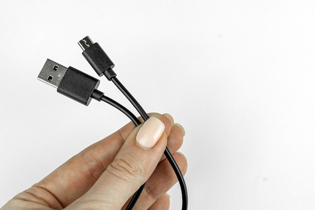 usb to micro usb cable in the hand