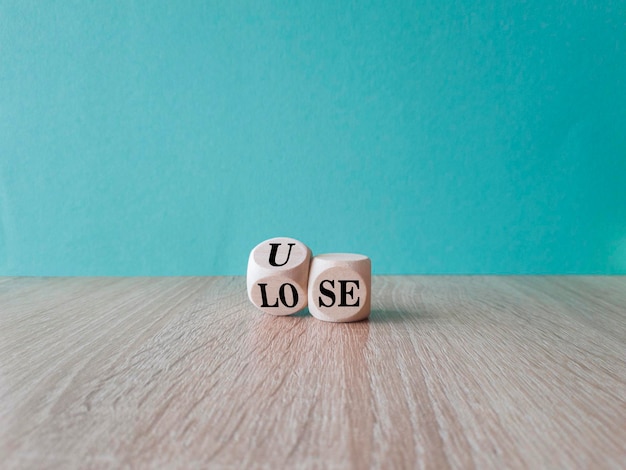 Use or lose symbol Concept words Use or lose on wooden cubes Beautiful wooden table