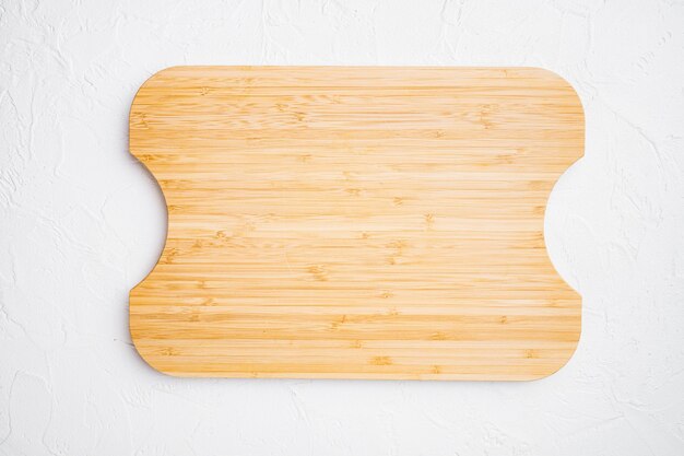 Used bamboo chopping board empty for empty for copy space for text or food top view flat lay on white stone table background