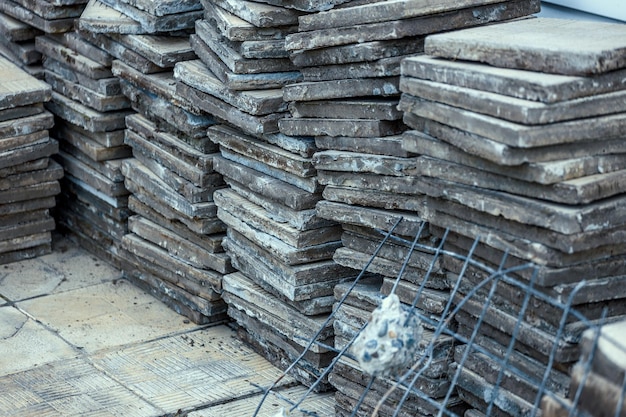 Used paving slabs have been dismantled and stacked