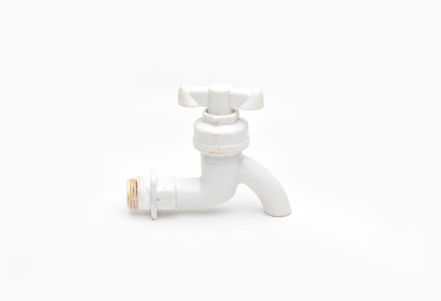 Used plumbing fitting pvc water tap close up view on isolated white background