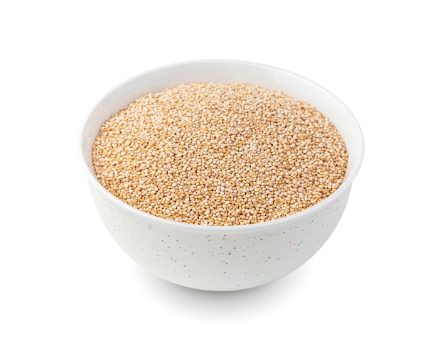 Useful quinoa seeds in a white cup are isolated on white Side view closeup Healthy food