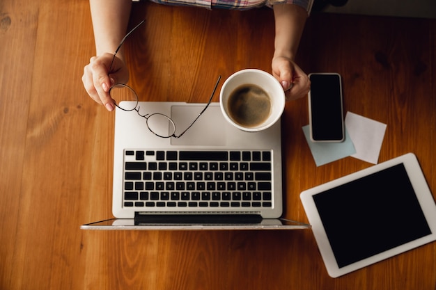 Using devices. Close up of caucasian female hands, working in office. Concept of business, finance, job, online shopping or sales. Copyspace . Education, communication freelance.