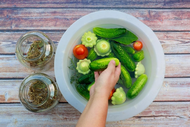 Using glass jars to pickle cucumbers tomatoes squash