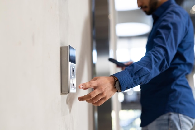 Photo using keycard man accessing secure entry system of office building