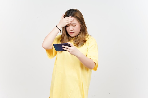 Using Smartphone of Beautiful Asian Woman wearing yellow TShirt Isolated On White Background