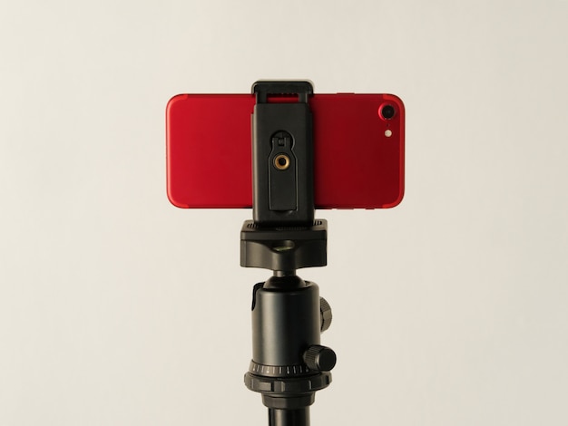 Using smartphone like professional photo camera on tripod.