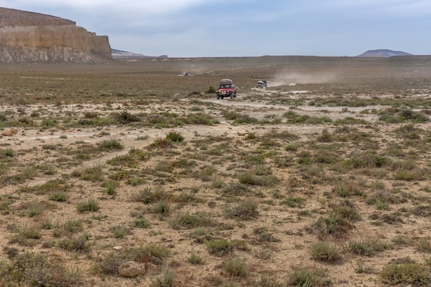 The Ustyurt Plateau. tourists travel by car. District of Boszhir. The bottom of a dry ocean Tethys