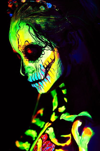 UV body art painting of Halloween female skeleton