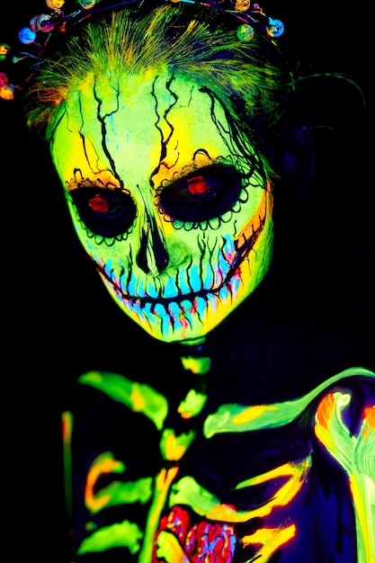 UV body art painting of Halloween female skeleton