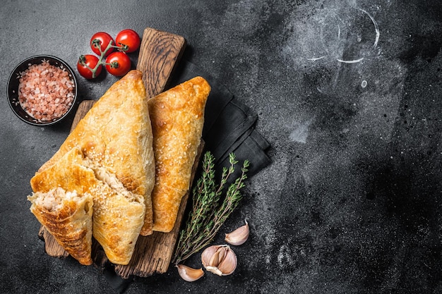 Uzbek and Central Asia samsa samosa pies Black background Top view Copy space